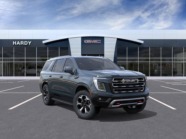 2026 GMC Yukon AT4 in Midnight Pine — front three-quarter view