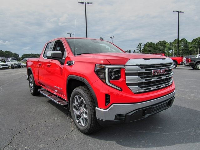 2026 GMC Sierra 1500 SLE in Cardinal Red — front three-quarter view
