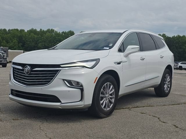2023 Buick Enclave Essence in Summit White — front three-quarter view